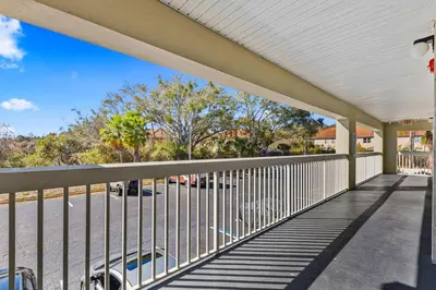 a balcony with a fence and a parking lot at Toy Story Magic Studio Close to Disney in Kissimmee