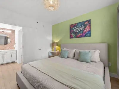 a bedroom with a large bed in a room at Florida vibe suite near Epic Universe & Universal in Orlando