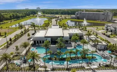 an aerial view of a resort with a pool at 2026 NEW 12Bedrooms12Bathroom At Paradiso Grande in Orlando