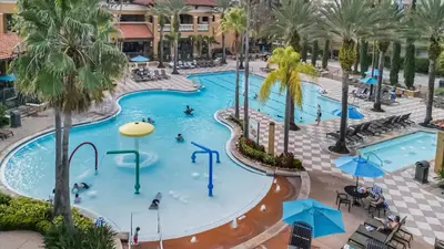 an overhead view of a swimming pool at a resort at 10 Mins To Disney NO FEES Heated Pool & Hot Tub in Orlando