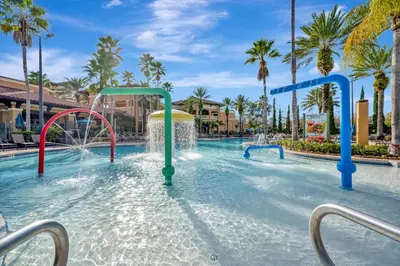a water park at a resort with a water slide at 10 Mins To Disney NO FEES Heated Pool & Hot Tub in Orlando