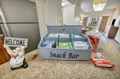 a box of snack bar on a counter with a toy at 10 Mins To Disney NO FEES Heated Pool & Hot Tub in Orlando