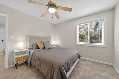 a bedroom with a bed and a ceiling fan at Modern 1BR with Premium Finishes in Orlando