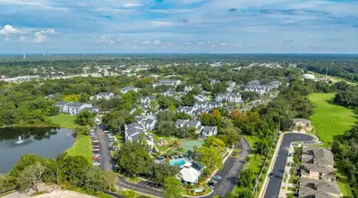 an aerial view of a resort with a lake and houses at Modern 1BR with Premium Finishes in Orlando