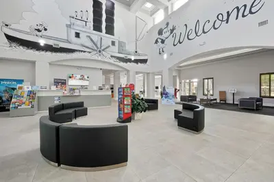 a lobby with chairs and a welcome sign in a store at Free Shuttle Mickey Universal Epic SeaWorld in Orlando