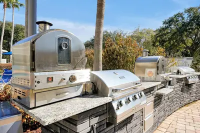 a group ofurgers and a grill on a stone counter at Free Shuttle Mickey Universal Epic SeaWorld in Orlando