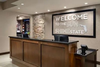a welcomeelcome to the sun shine state sign in a lobby at Hampton Inn & Suites Orlando/Downtown South - Medical Center in Orlando
