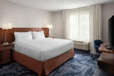 a hotel room with a large bed and a window at Fairfield Inn & Suites by Marriott Orlando Kissimmee/Celebration in Orlando