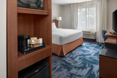 a hotel room with a bed and a television at Fairfield Inn & Suites by Marriott Orlando Kissimmee/Celebration in Orlando