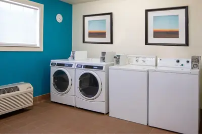 a laundry room with a washer and dryer at Residence Inn Orlando Convention Center in Orlando