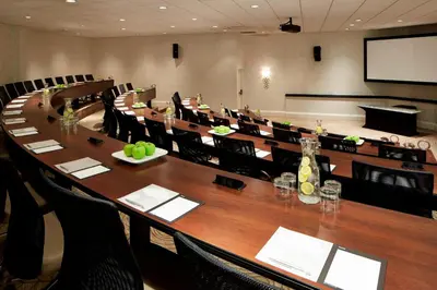 a large conference room with a long table and chairs at Renaissance Orlando Airport Hotel in Orlando