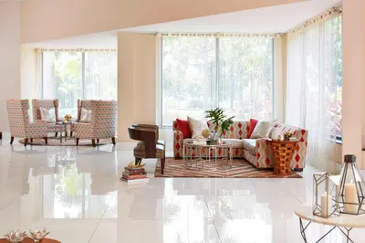 a living room with a couch and a table at Renaissance Orlando Airport Hotel in Orlando