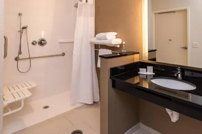 a bathroom with a sink and a shower at Fairfield Inn & Suites by Marriott Orlando East/UCF Area in Orlando