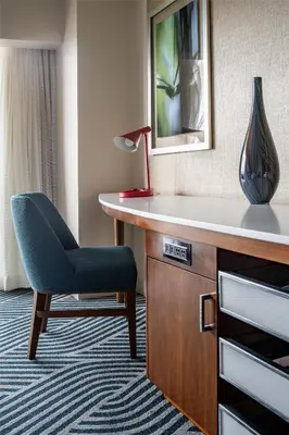 a room with a desk with a chair and a vase at Hyatt Regency Grand Cypress Resort - Free Shuttle to Theme Parks! in Orlando