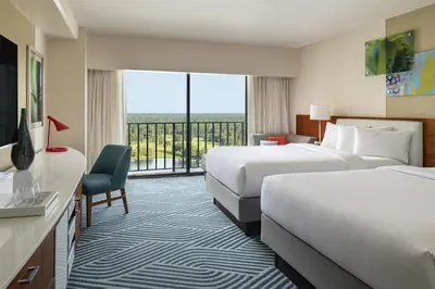 a hotel room with two beds and a large window at Hyatt Regency Grand Cypress Resort - Free Shuttle to Theme Parks! in Orlando