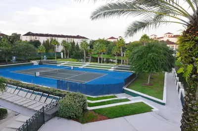 a tennis court in a resort with a tennis at Star Island Resort and Club - Near Disney in Kissimmee