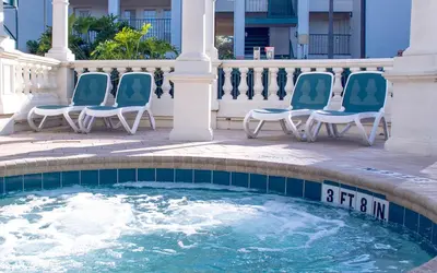 a group of chairs sitting around a pool at Star Island Resort and Club - Near Disney in Kissimmee