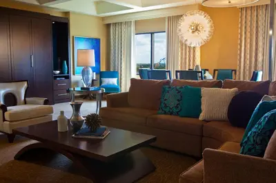 a living room with a couch and a table at Renaissance Orlando at SeaWorld® in Orlando