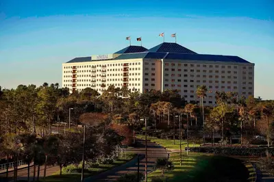 a large building with two flags on top of it at Renaissance Orlando at SeaWorld® in Orlando