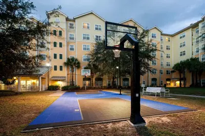 a basketball hoop in front of a building at Residence Inn by Marriott Orlando at SeaWorld in Orlando