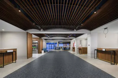 an empty lobby with a large ceiling with wood at Courtyard by Marriott Orlando Lake Buena Vista at Vista Centre in Orlando
