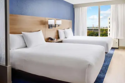two beds in a hotel room with a window at Hyatt Place across from Universal Orlando Resort in Orlando
