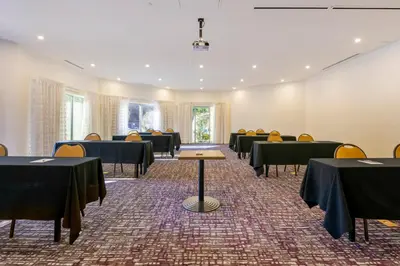 a conference room with tables and chairs in it at Crowne Plaza Orlando - Lake Buena Vista by IHG in Orlando