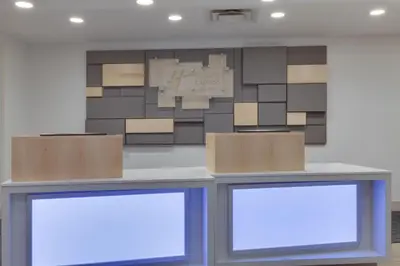 two boxes sitting on top of a counter in a room at Holiday Inn Express & Suites Orlando International Airport by IHG in Orlando