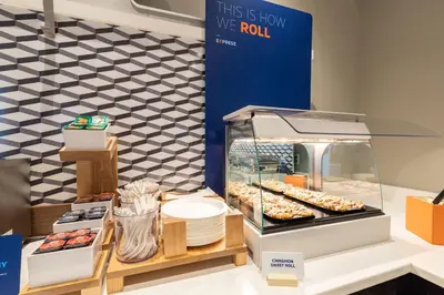 a display case with donuts and other pastries at Holiday Inn Express Orlando-Ocoee East by IHG in Orlando