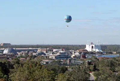 a hot air balloon flying over a city at Holiday Inn Orlando – Disney Springs® Area by IHG in Orlando