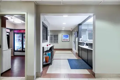 an open hallway with a kitchen and dining room at Candlewood Suites Lake Mary by IHG in Lake Mary