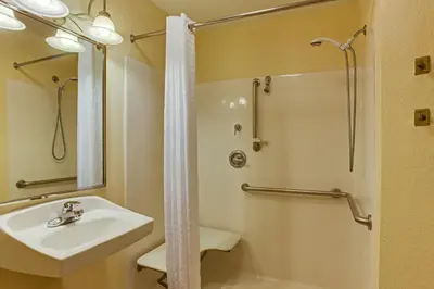 a bathroom with a sink and a shower at Candlewood Suites Lake Mary by IHG in Lake Mary