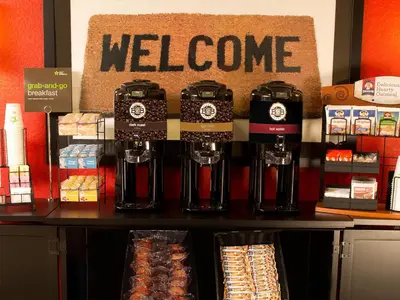 a store with a welcome sign on a counter at Extended Stay America Suites - Orlando - Convention Center - Universal Blvd in Orlando
