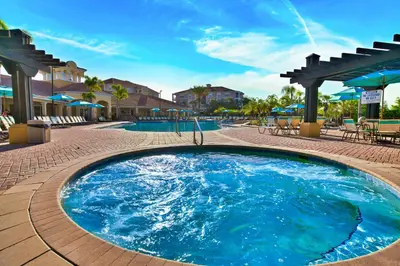 a large pool with blue water in a resort at Hidden Treasure in Orlando