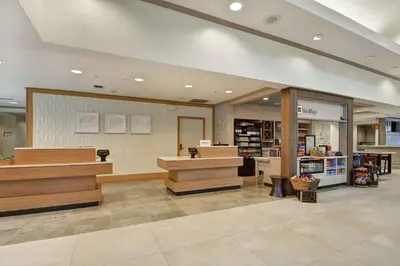 a store lobby with wooden counters in a store at Hilton Garden Inn Orlando Lake Buena Vista in Orlando