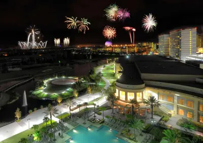 a view of a building with fireworks in the background at Waldorf Astoria Orlando - An Official Walt Disney World Hotel in Orlando