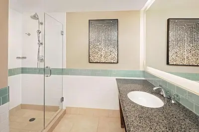 a bathroom with a sink and a shower at Hilton Grand Vacations Club Parc Soleil Orlando in Orlando