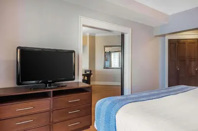 a bedroom with a flat screen tv on a dresser at Bluegreen Vacations Fountains, an Ascend Collection Resort in Orlando