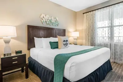 a bedroom with a large bed and a window at Bluegreen Vacations Fountains, an Ascend Collection Resort in Orlando