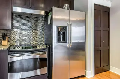 a stainless steel refrigerator in a kitchen at Bluegreen Vacations Fountains, an Ascend Collection Resort in Orlando