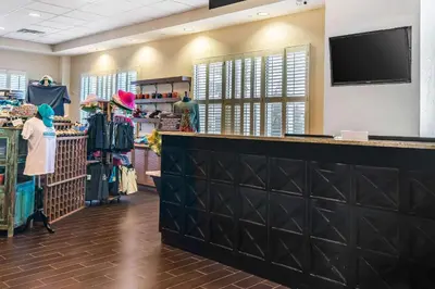 a clothing store with a flat screen tv on the wall at Bluegreen Vacations Fountains, an Ascend Collection Resort in Orlando