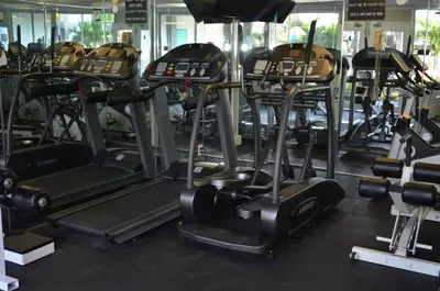 a gym with a bunch of cardio machines at Opal Hotel & Suites in Orlando