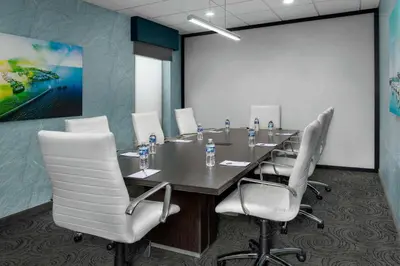 a conference room with a long table and chairs at Hampton Inn & Suites at Lake Mary Colonial Townpark in Lake Mary