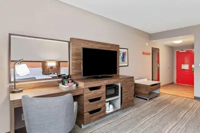 a hotel room with a television and a bed at Hampton Inn & Suites Orlando-Apopka in Orlando