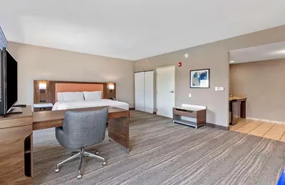 a hotel room with a bed and a desk at Hampton Inn & Suites Orlando-Apopka in Orlando