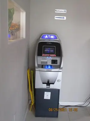 an atm machine sitting in a corner next to a wall at Quality Inn & Suites Kissimmee near Main Gate in Orlando