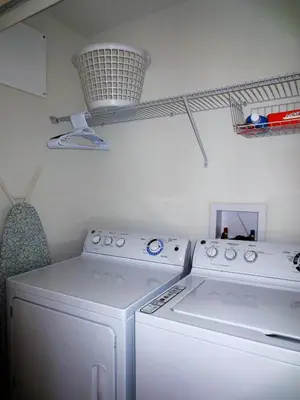 a laundry room with a washer and dryer at Family 4-Bedroom Pool Home Near Disney World in Kissimmee