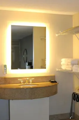 a bathroom with a sink and a mirror at Magic Key - Near Disney in Kissimmee
