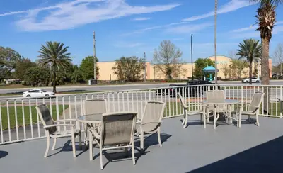 a group of tables and chairs on a patio at Magic Key - Near Disney in Kissimmee