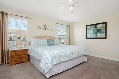 a bedroom with a bed and a window at Four Bedrooms Home with Pool 3079 in Kissimmee